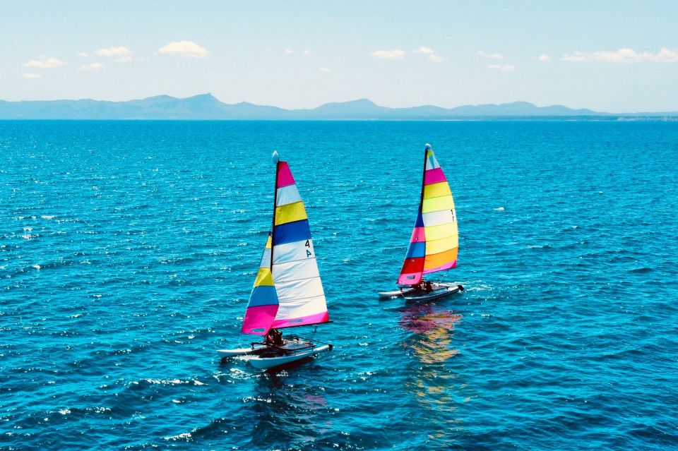 Alcudia: 1-Hour Catamaran Experience with Monitor for 2 - Coastline Views: Alcúdia, Playa de Muro, and Aucanada From the Water