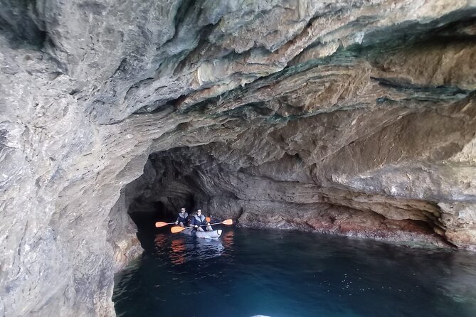 Alcudia: Guided Sea Kayaking & snorkelling Tour (day & sunset) - Cave time: swim entry, guide lights, and what to bring for photos