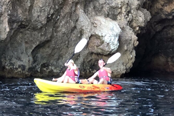 Breathtaking guided Kayak tour from Sant Elm the bay of Cala en Tió - Break time: swimming, snorkeling, and the snack factor