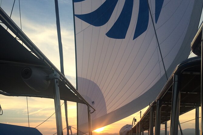 Catamaran sailing at sunset with tapas Palma de Mallorca - Tapas and Canapés on Board: What Included Food Really Means