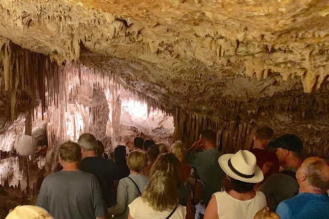Guided Full-Day Tour of Drach Caves, Porto Cristo & Pearl Factory - Entering Mallorca’s Cuevas del Drach: music, boats, and the long underground walk