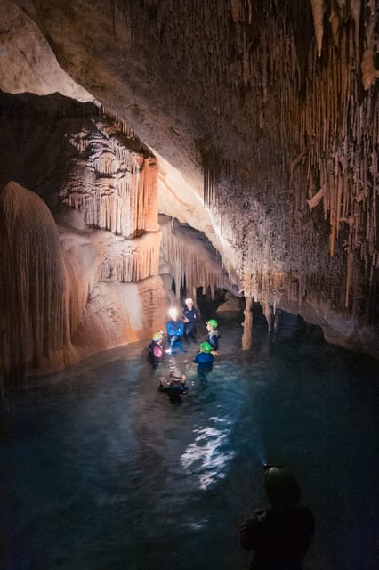 Mallorca: Cala Romántica Cliff Hike and Sea Cave Tour - Neoprene up and headlamp on: the sea cave swim and underground galleries