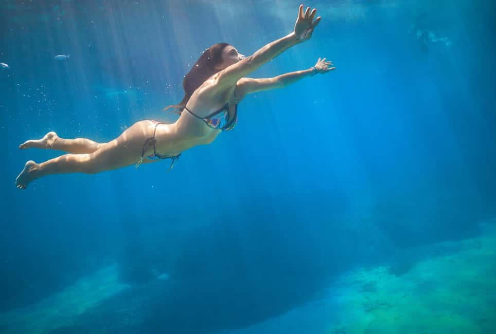 Mallorca: Caves, Cliffs, and Coves Boat Trip - Crew and On-Board Vibes: Friendly Service with a Fun Twist